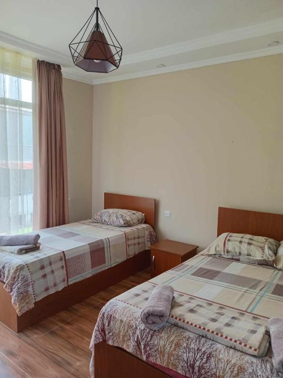 Postel nebo postele na pokoji v ubytování Guest house Gio