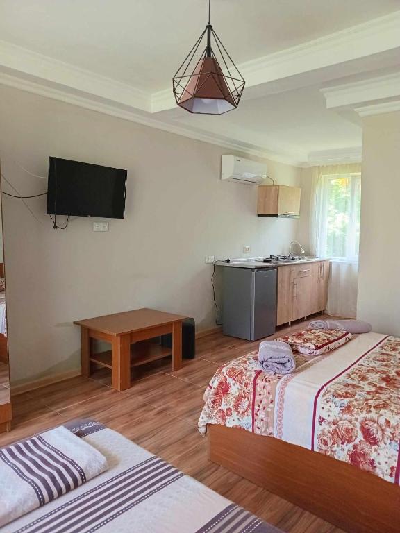 Postel nebo postele na pokoji v ubytování Guest house Gio