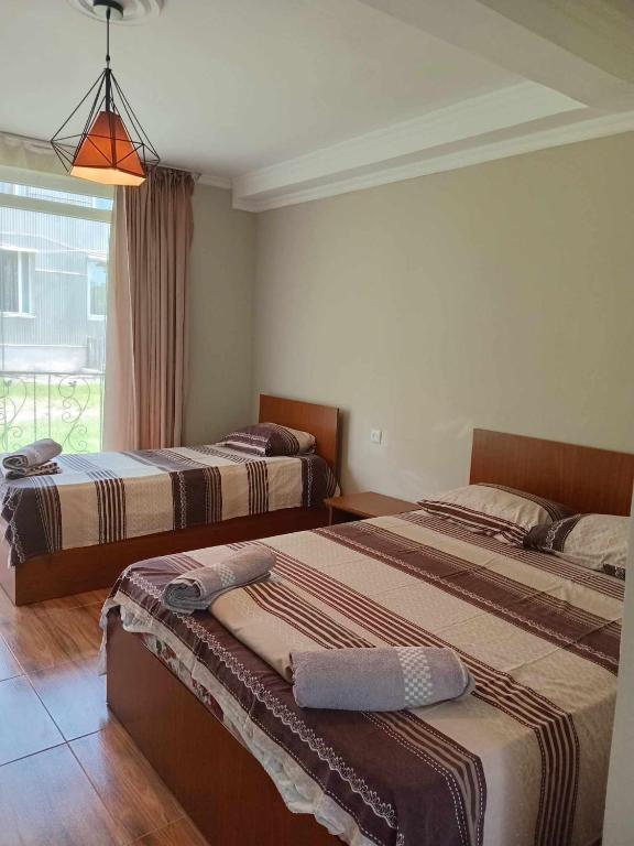 Postel nebo postele na pokoji v ubytování Guest house Gio