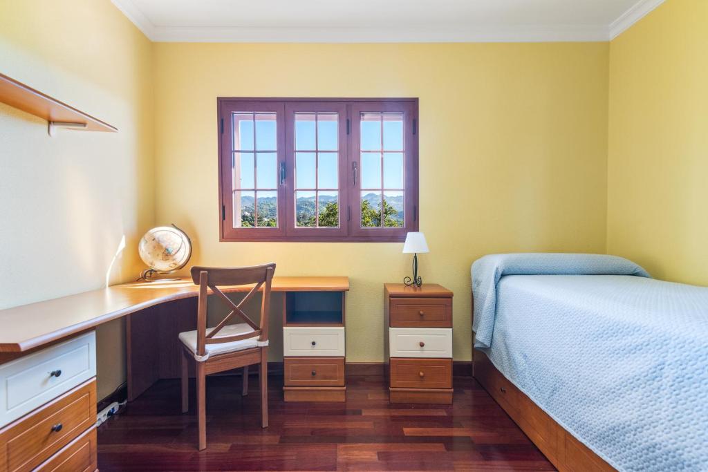 A bed or beds in a room at Villa Arrebol Azul