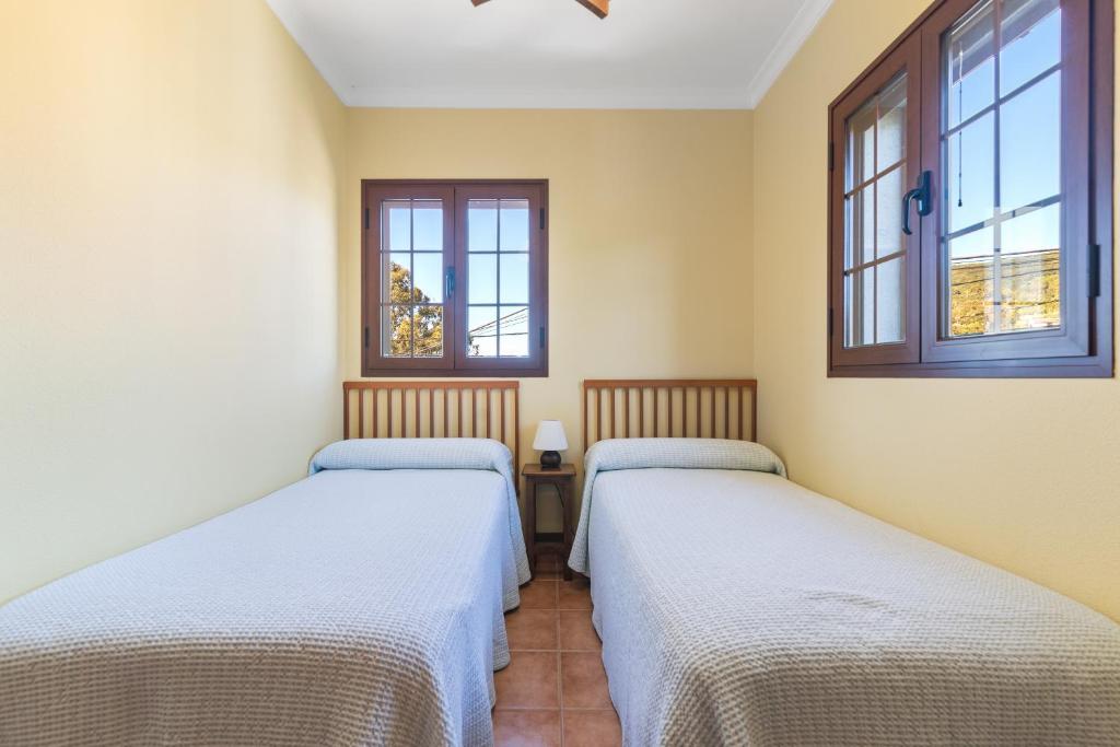 A bed or beds in a room at Villa Arrebol Azul