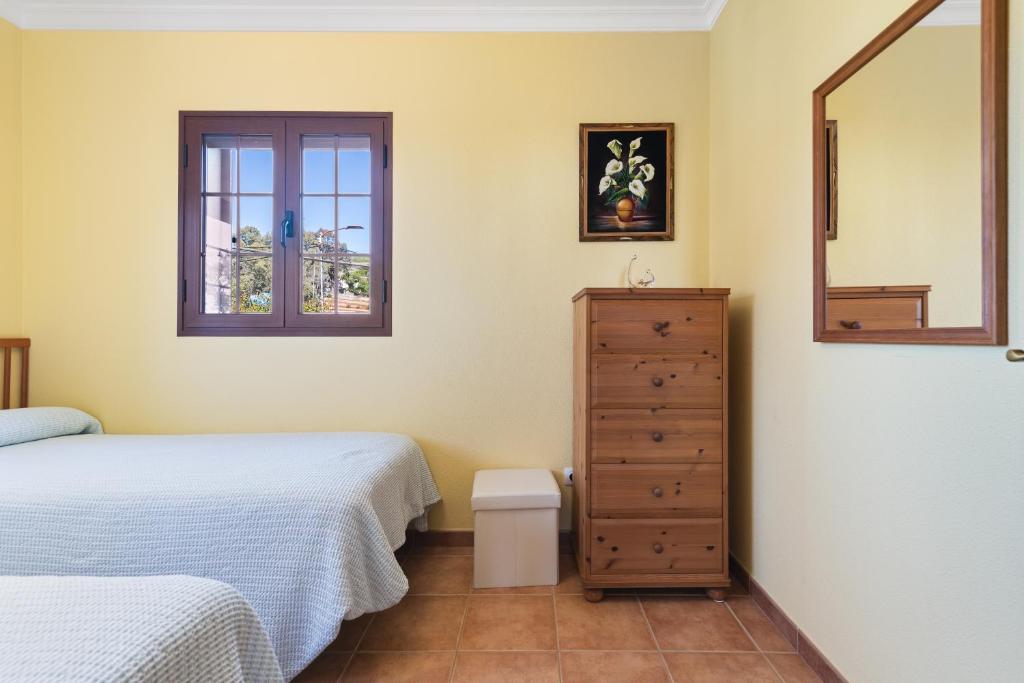 A bed or beds in a room at Villa Arrebol Azul