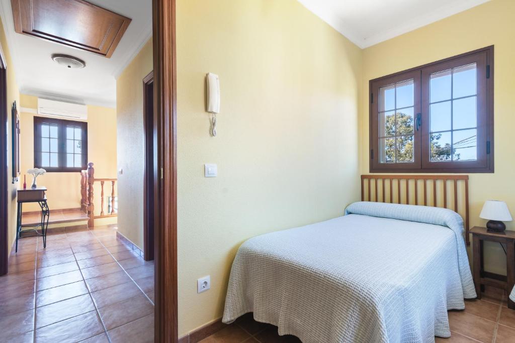 A bed or beds in a room at Villa Arrebol Azul