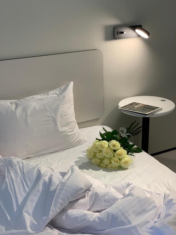 Postel nebo postele na pokoji v ubytování Ultramarinn Hotel