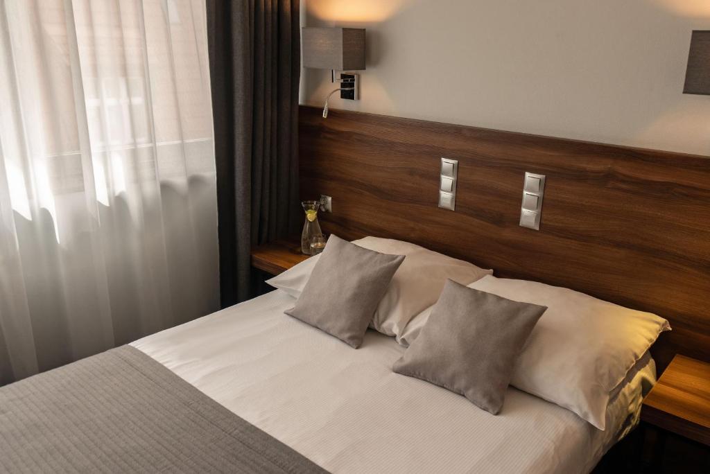 Posteľ alebo postele v izbe v ubytovaní Hotel Oliwski