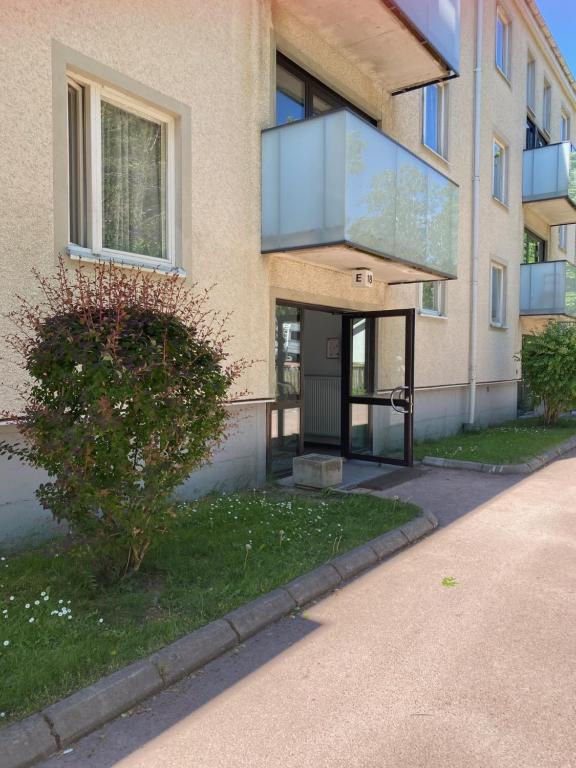 a building with a glass door on the side of it at Trivsam 1 a in Mariehamn