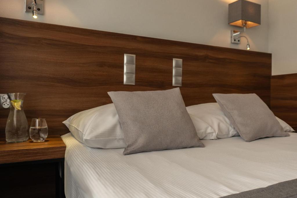 Posteľ alebo postele v izbe v ubytovaní Hotel Oliwski
