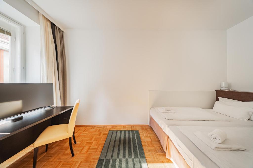 Posteľ alebo postele v izbe v ubytovaní Serviced Apartments Josefstadt City