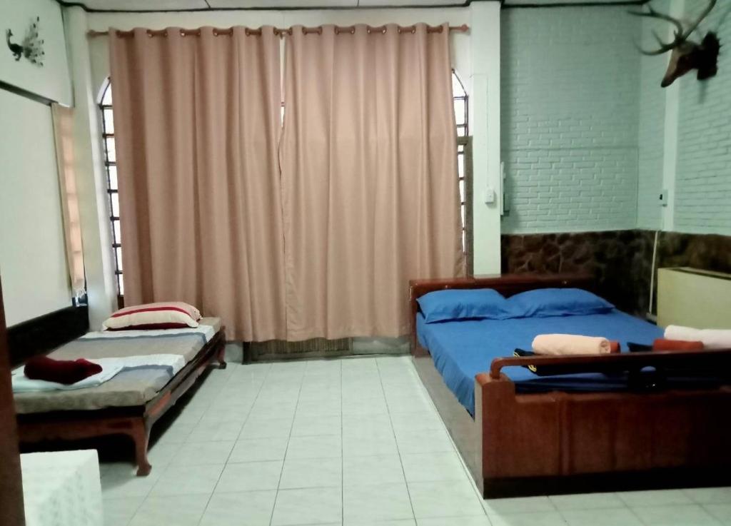 Postel nebo postele na pokoji v ubytování Casa Bonita Kanchanaburi