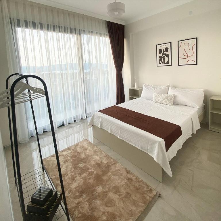 Ένα ή περισσότερα κρεβάτια σε δωμάτιο στο High Garden Villas