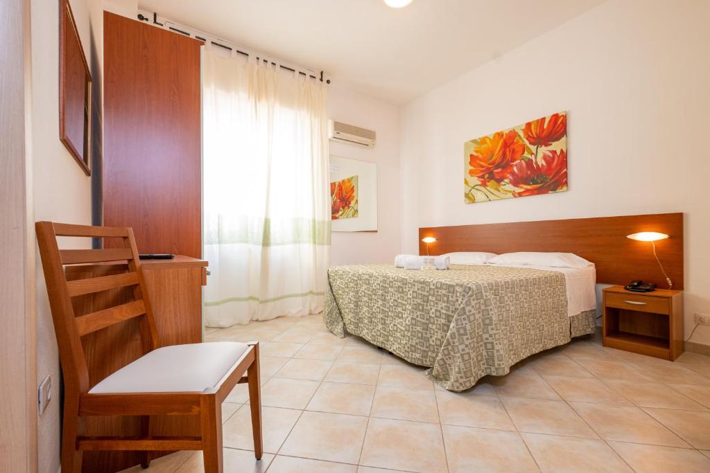 Postel nebo postele na pokoji v ubytování Hotel Il Gabbiano
