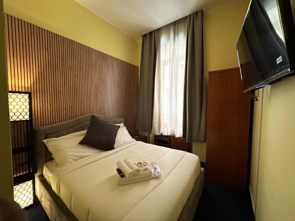 Postel nebo postele na pokoji v ubytování Hotel Rome place