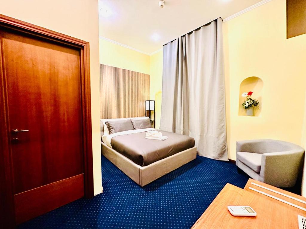Postel nebo postele na pokoji v ubytování Hotel Rome place