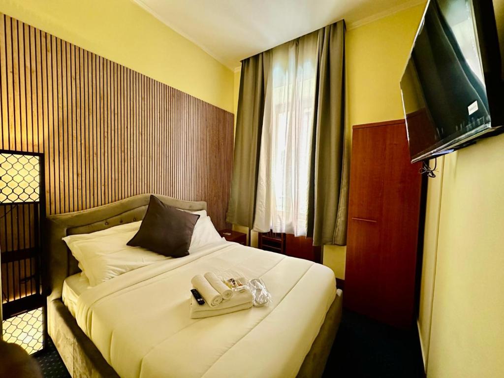 Postel nebo postele na pokoji v ubytování Hotel Rome place