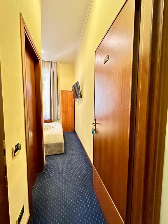 Postel nebo postele na pokoji v ubytování Hotel Rome place