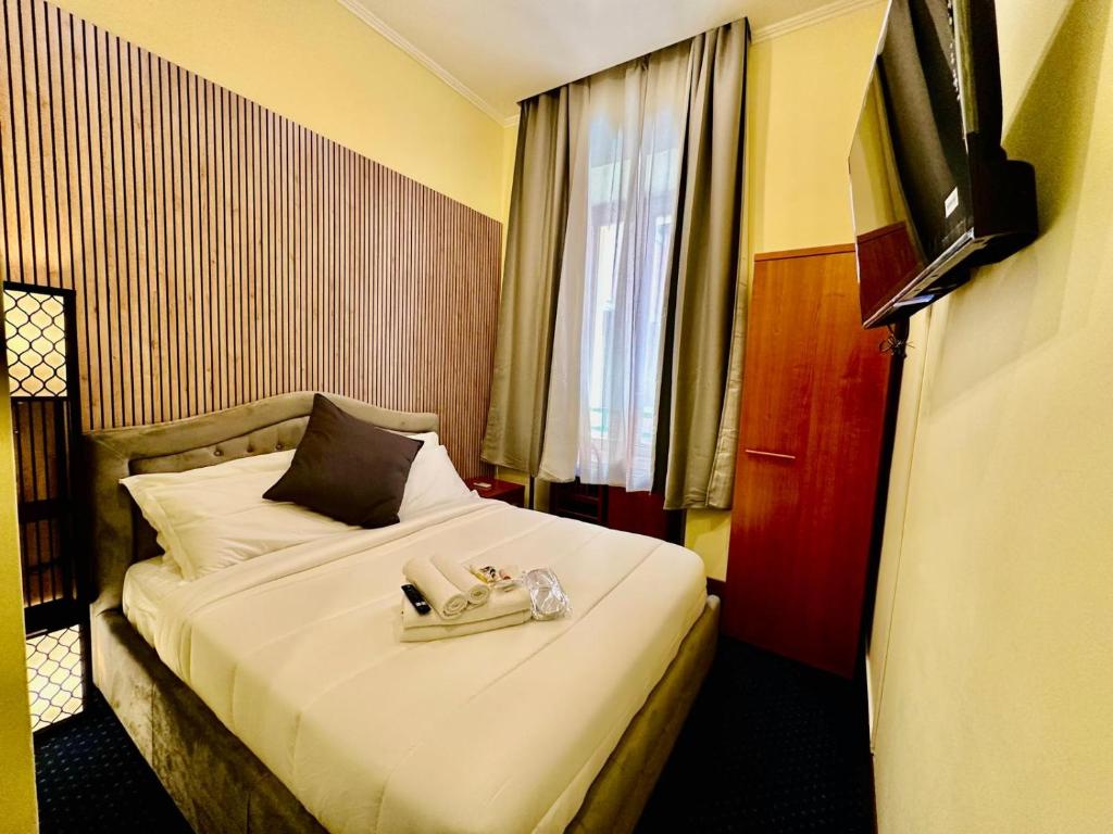 Postel nebo postele na pokoji v ubytování Hotel Rome place
