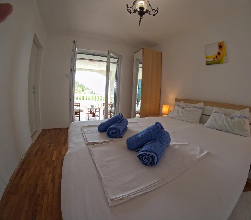 Posteľ alebo postele v izbe v ubytovaní Jadran Apartmani