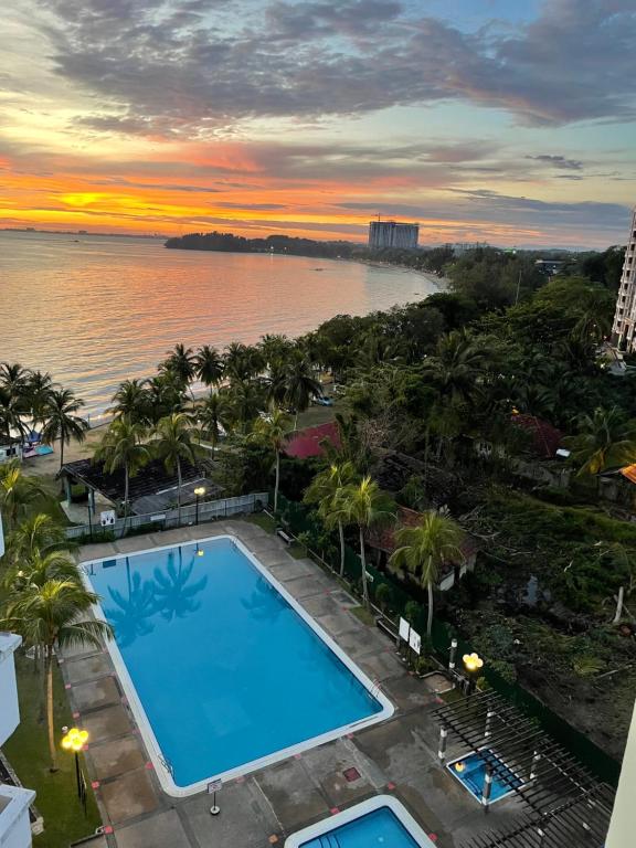 a view of the pool atilon beach hotel resort or nearby at Seri Bulan Apartment Teluk Kemang in Port Dickson