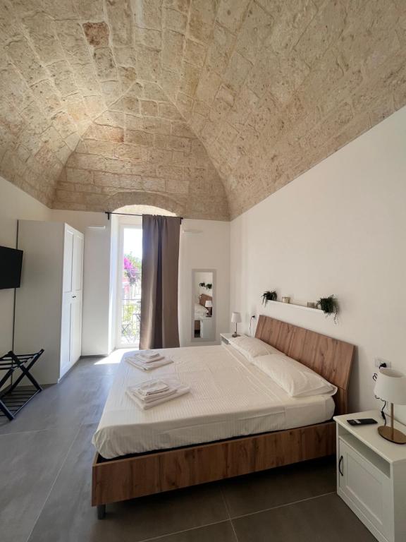 Giường trong phòng chung tại Casa LA TORRETTA