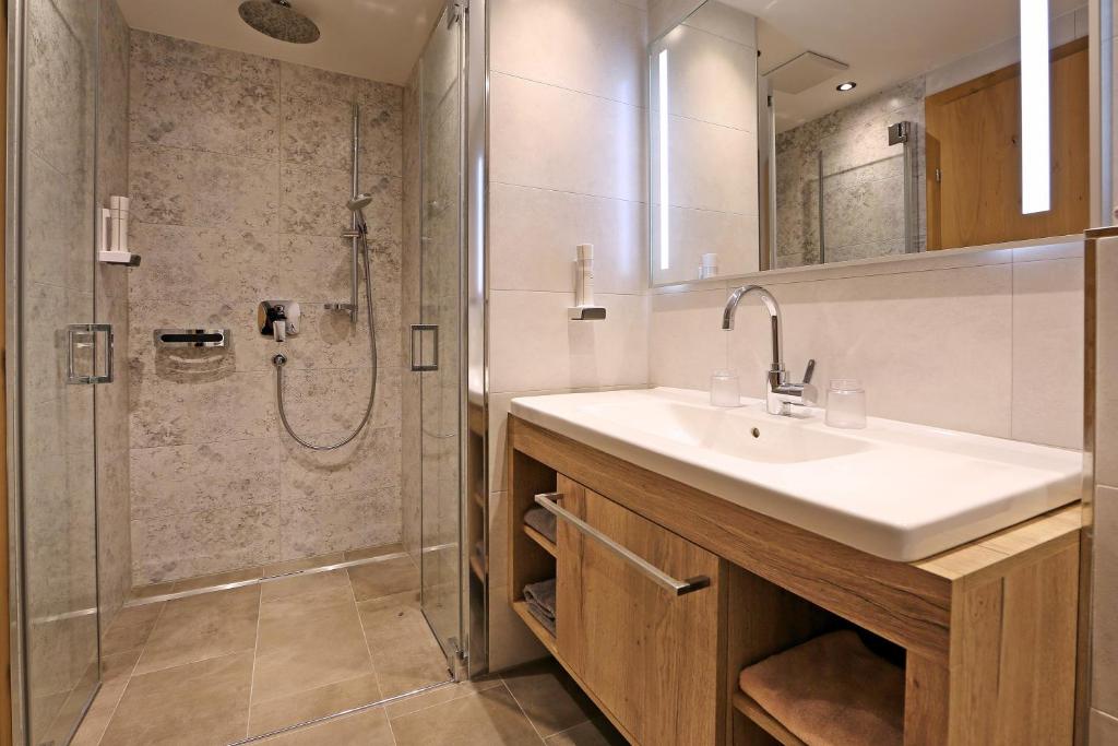 Koupelna v ubytování hin&weg das Aparthotel