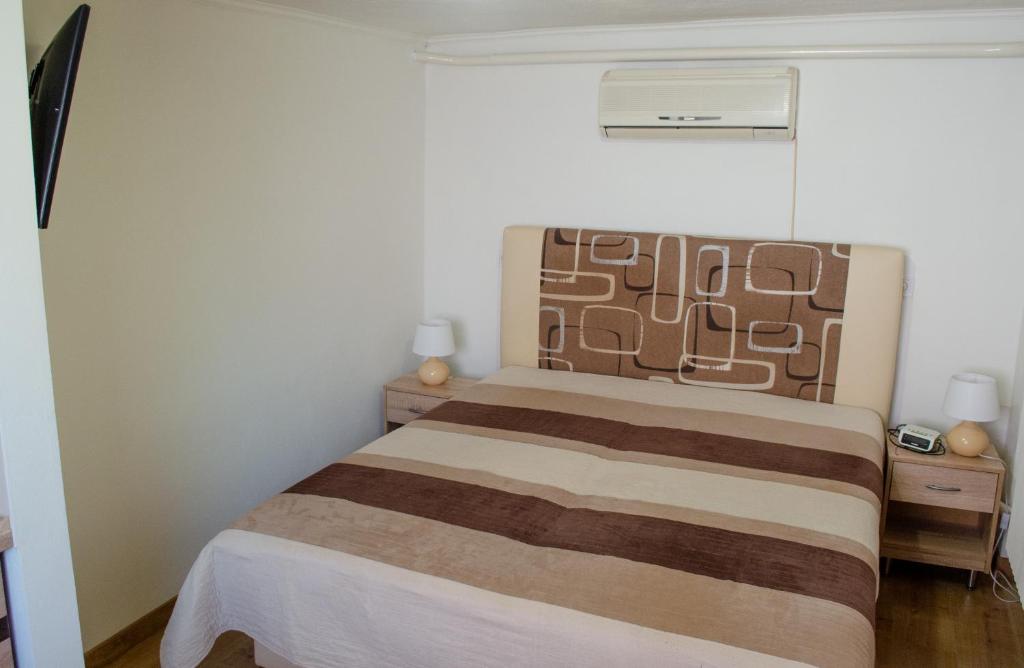 Postel nebo postele na pokoji v ubytování Apartmány u Jozefa