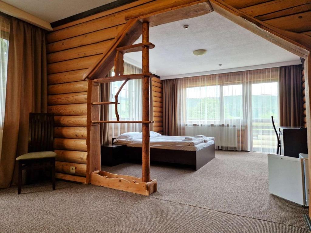 Ένα ή περισσότερα κρεβάτια σε δωμάτιο στο Complex Hyzhky