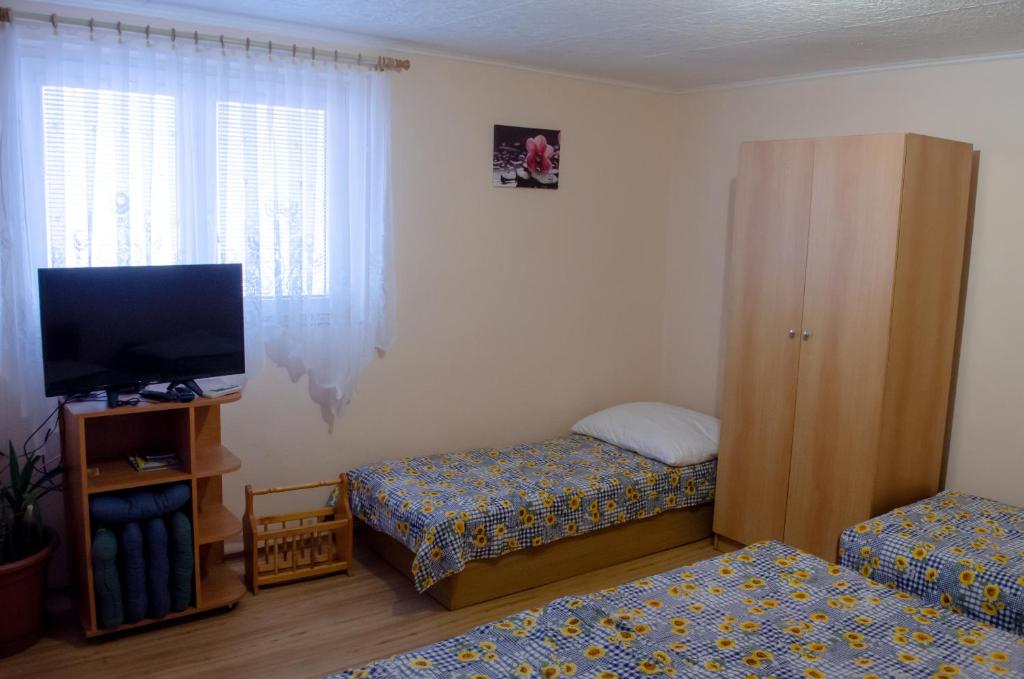 Postel nebo postele na pokoji v ubytování Apartmány u Jozefa