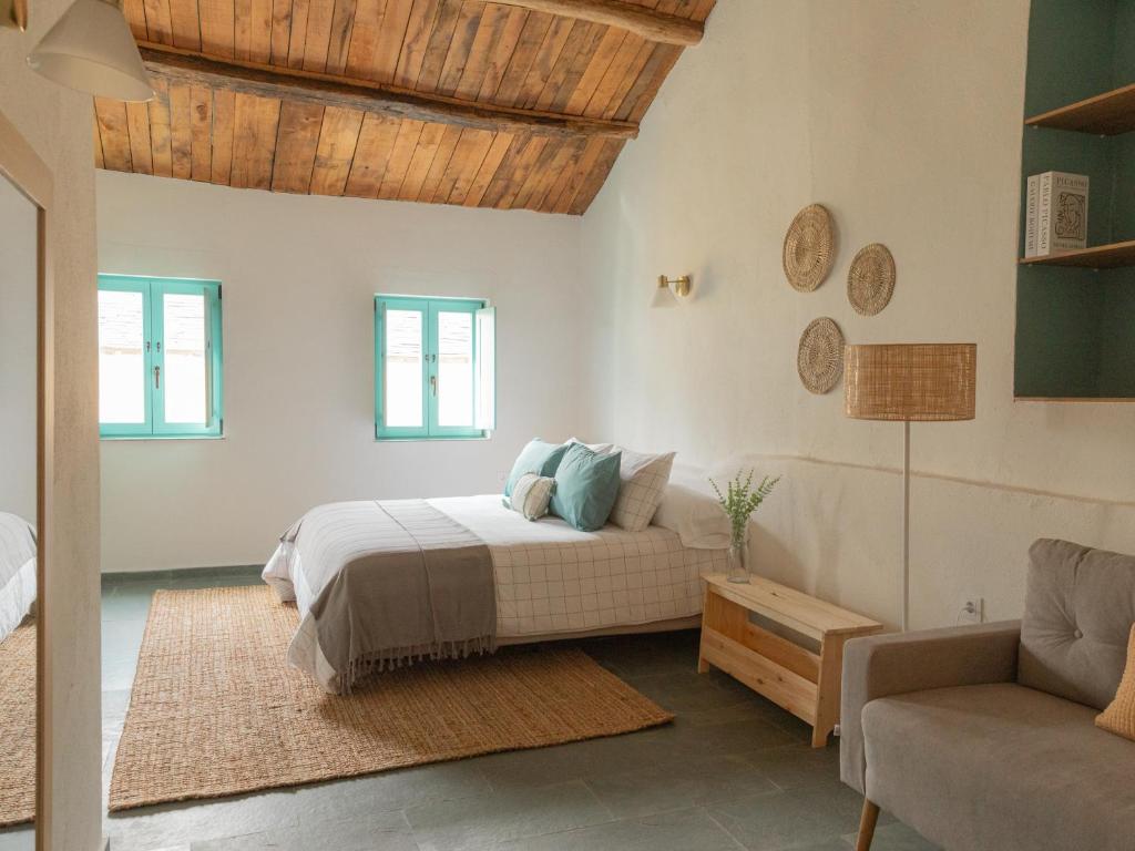 Ένα ή περισσότερα κρεβάτια σε δωμάτιο στο Casa Marela