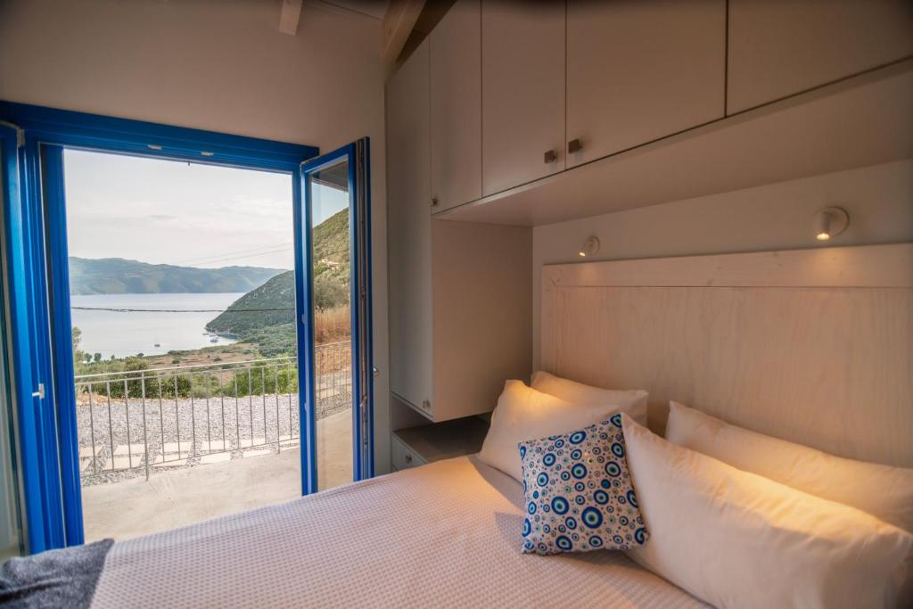 Postel nebo postele na pokoji v ubytování ONIRO Villas