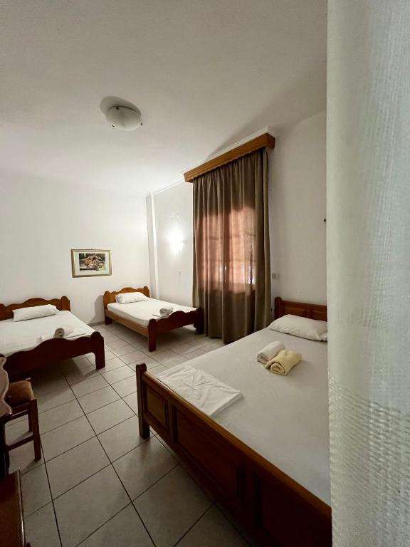 Posteľ alebo postele v izbe v ubytovaní Boufidis Rooms