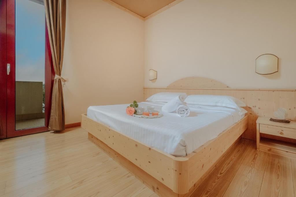 Postel nebo postele na pokoji v ubytování Garden Relais