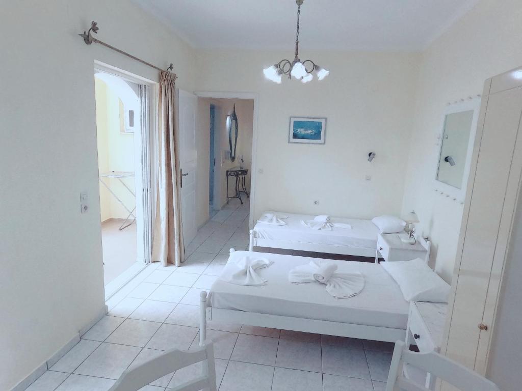 Postel nebo postele na pokoji v ubytování Palladion Hotel