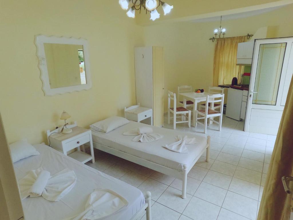 Postel nebo postele na pokoji v ubytování Palladion Hotel