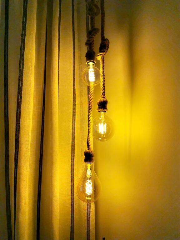 a group of light bulbs hanging from a curtain at Seashell luxury apartment in Burnham on Sea