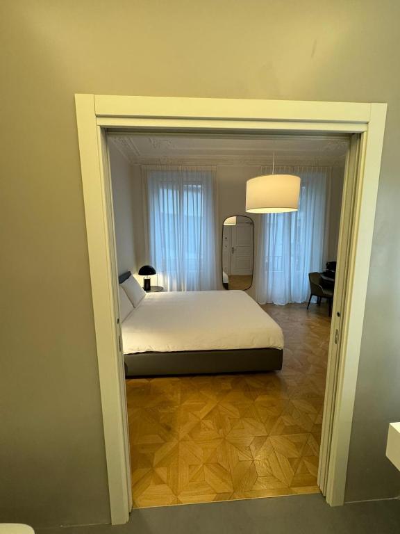 Postel nebo postele na pokoji v ubytování Delle Nazioni Milan Hotel