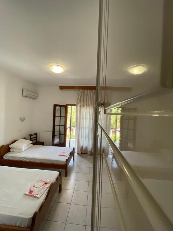 Posteľ alebo postele v izbe v ubytovaní Boufidis Rooms