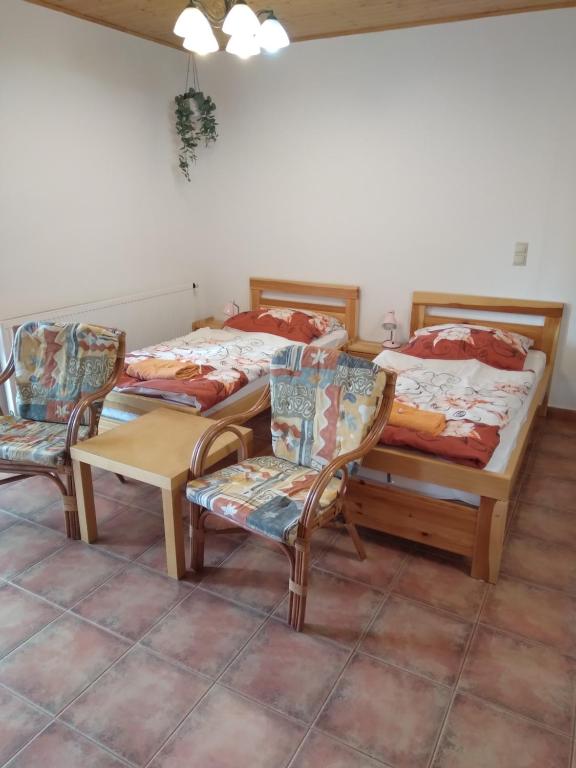 Postel nebo postele na pokoji v ubytování Penzion HORTENZIE