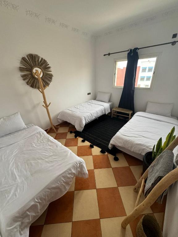 Postel nebo postele na pokoji v ubytování Olas Surf Camp