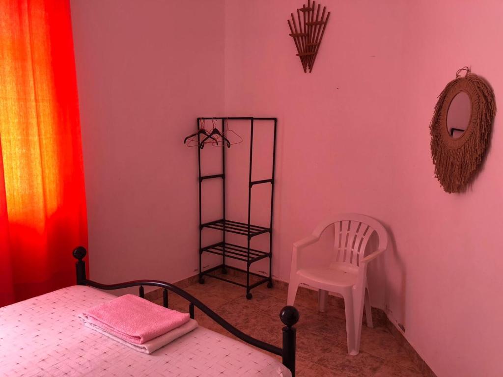 Postel nebo postele na pokoji v ubytování Tarrafal Ecodécor Rooms