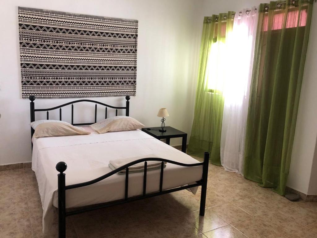 Postel nebo postele na pokoji v ubytování Tarrafal Ecodécor Rooms