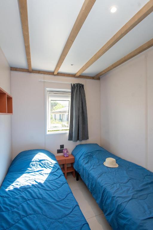 Postel nebo postele na pokoji v ubytování Parc Saint James Oasis Village