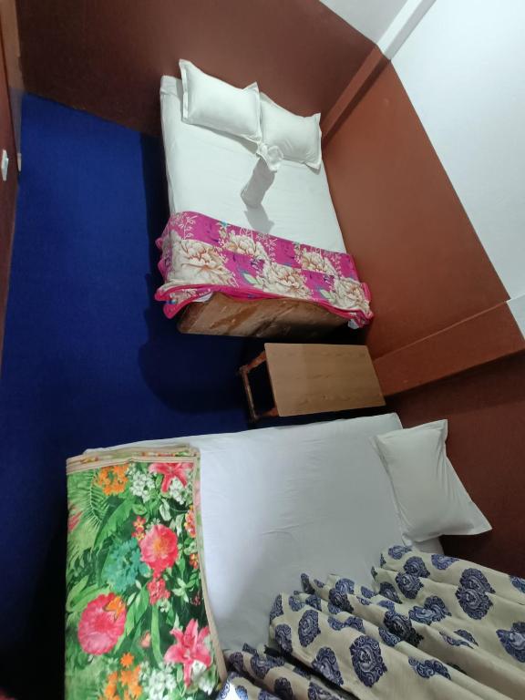 Postel nebo postele na pokoji v ubytování Hotel Sai Aman
