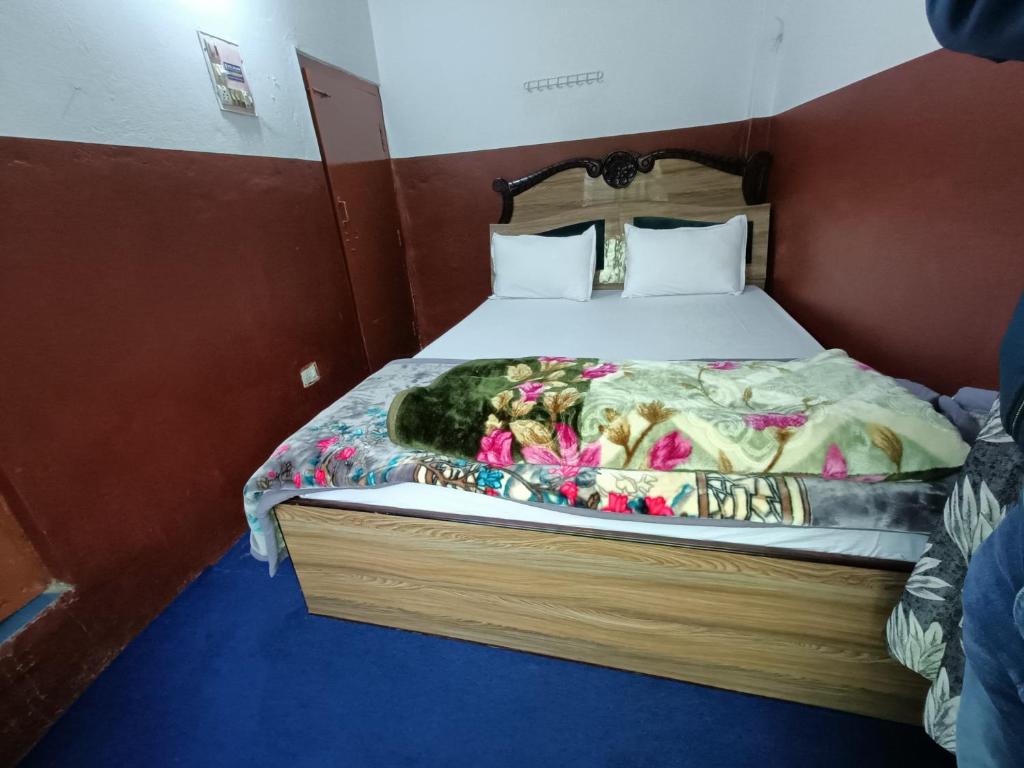 Postel nebo postele na pokoji v ubytování Hotel Sai Aman