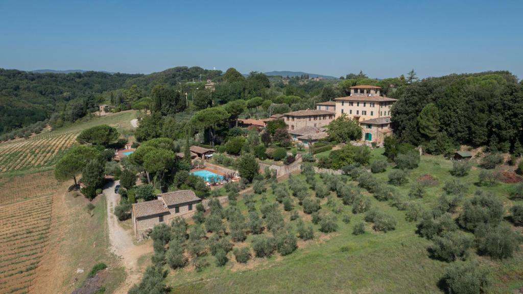 an aerial view of a house on a hill with trees at Villa Agostoli in Siena