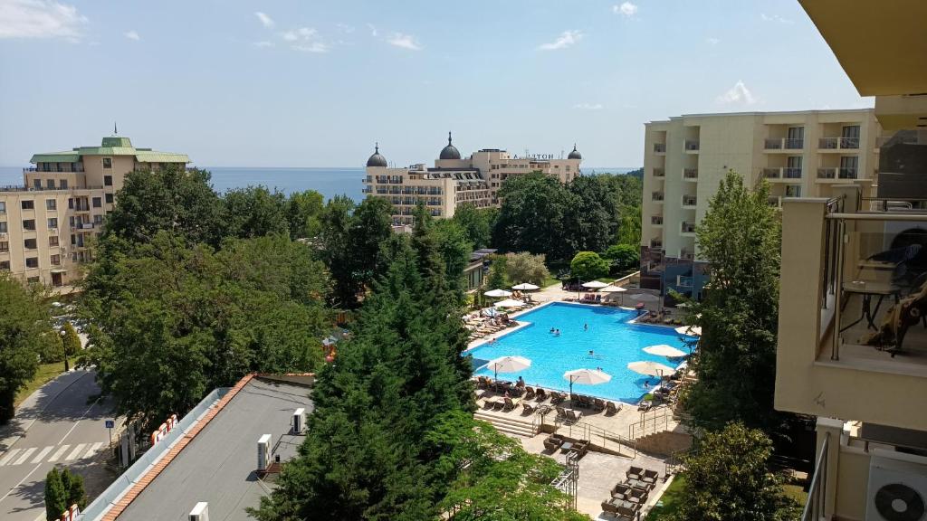 a view of a swimming pool from a building at Apart Hotel Golden Line private apartments in Golden Sands