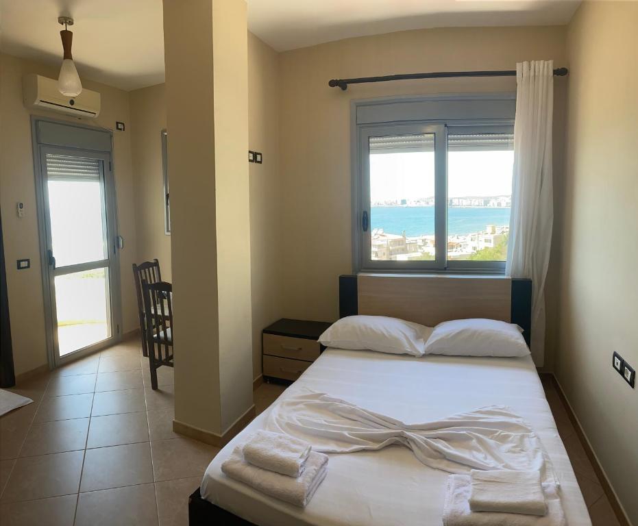 Postel nebo postele na pokoji v ubytování AL Hotel