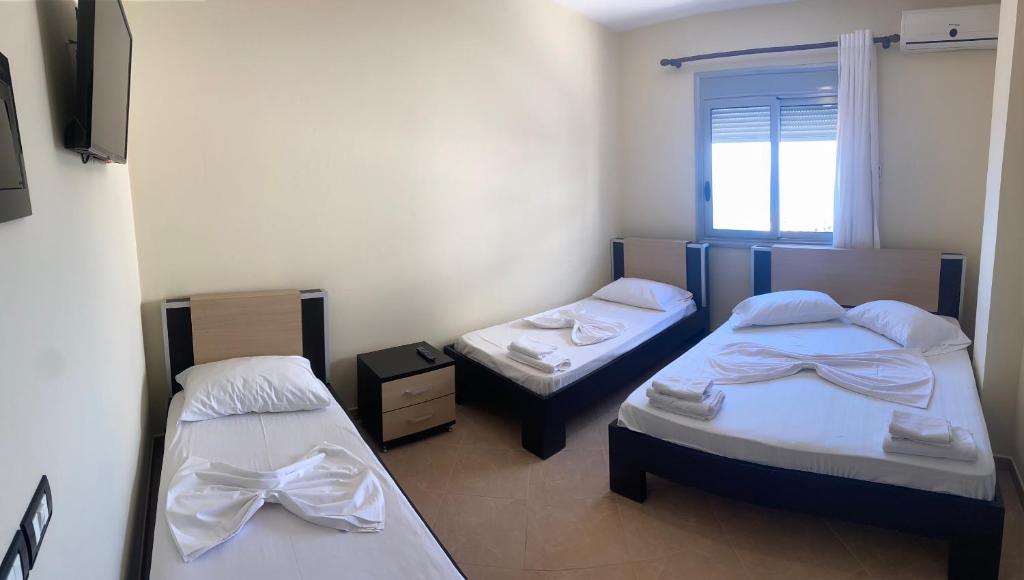 Postel nebo postele na pokoji v ubytování AL Hotel