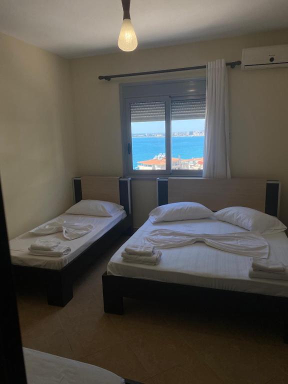 Postel nebo postele na pokoji v ubytování AL Hotel