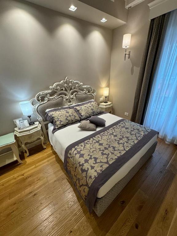 Postel nebo postele na pokoji v ubytování Delle Nazioni Milan Hotel