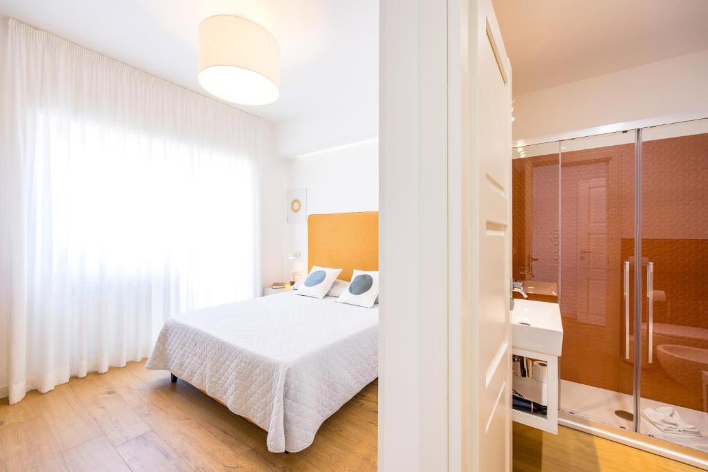 Postel nebo postele na pokoji v ubytování Le Terrazze di Santa Tecla
